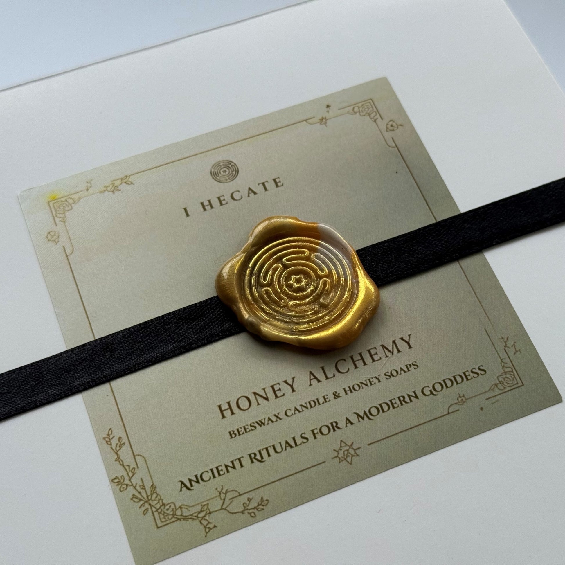 Honey Alchemy product with gold wax seal on a box, I Hecate product