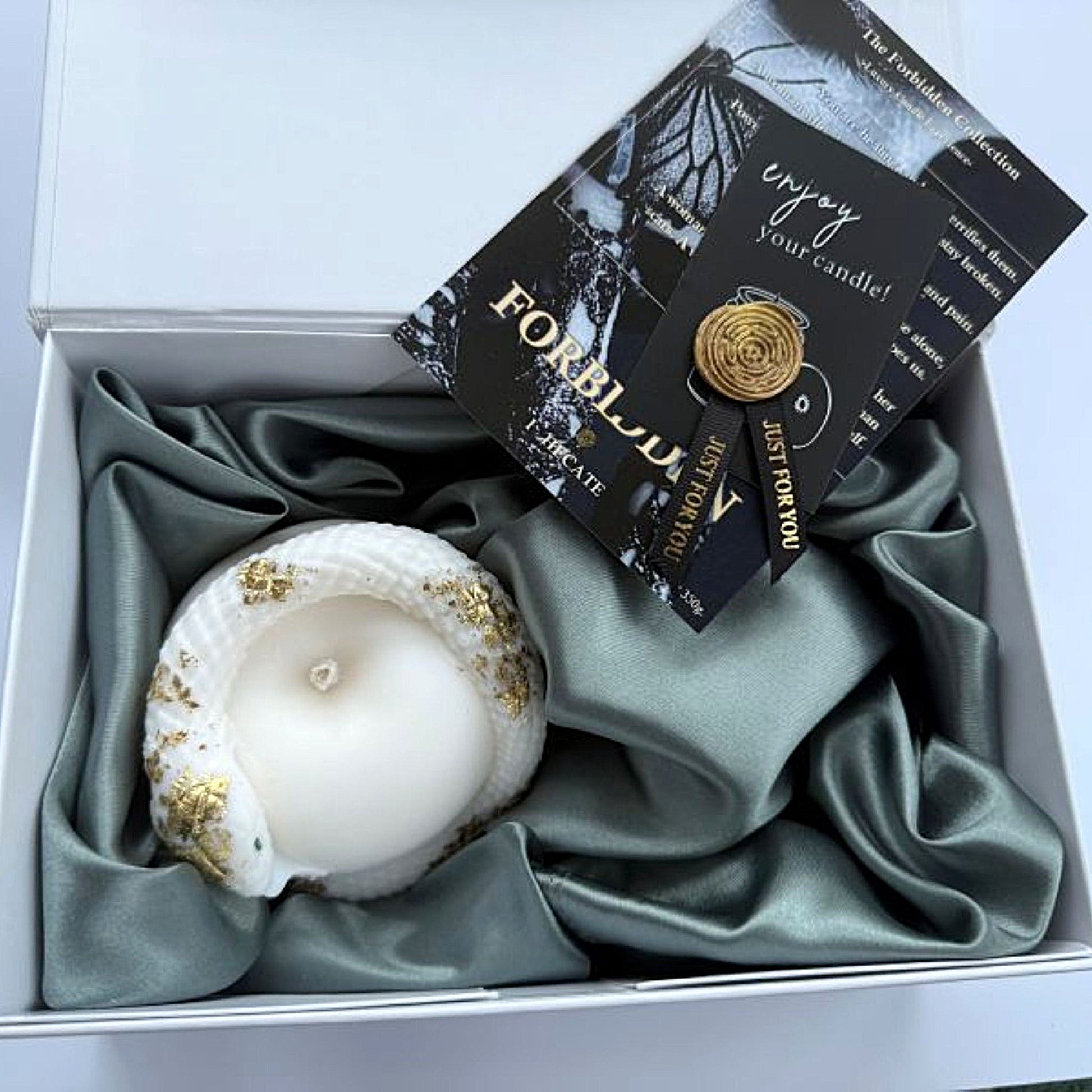 Candle in a box with decorative packaging and card