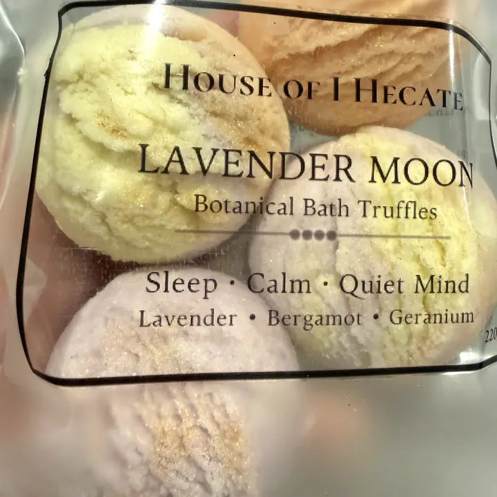 Packaged botanical bath truffles labeled 'House of Hecate Lavender Moon' with scents listed.